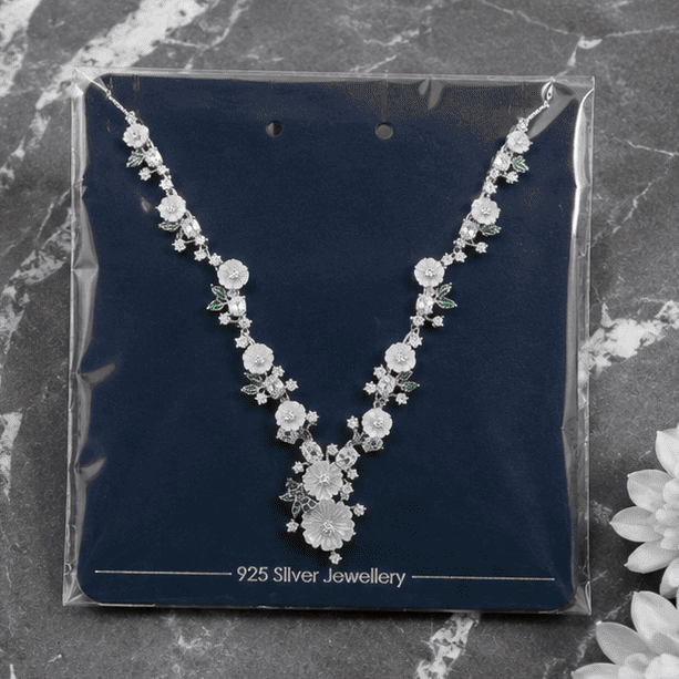Alt Text:
925 sterling silver floral blossom necklace displayed in premium retail packaging with elegant floral detailing and adjustable chain.