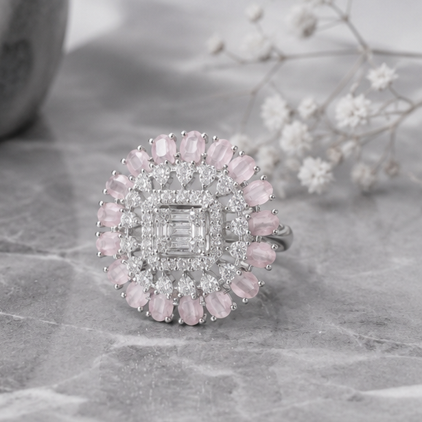 Close-up of the Rosé Royale adjustable ring showcasing the emerald-cut center stone, blush pink gemstones, and brilliant zircon detailing.