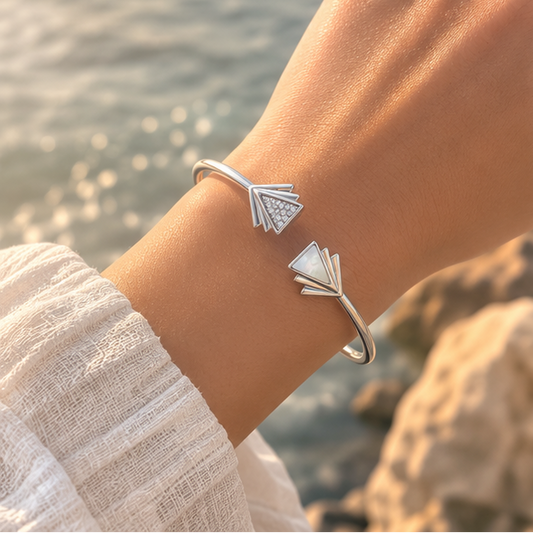 Close-up of the Vrindae Argente Astera silver arrow bracelet with cubic zirconia and mother-of-pearl detailing.