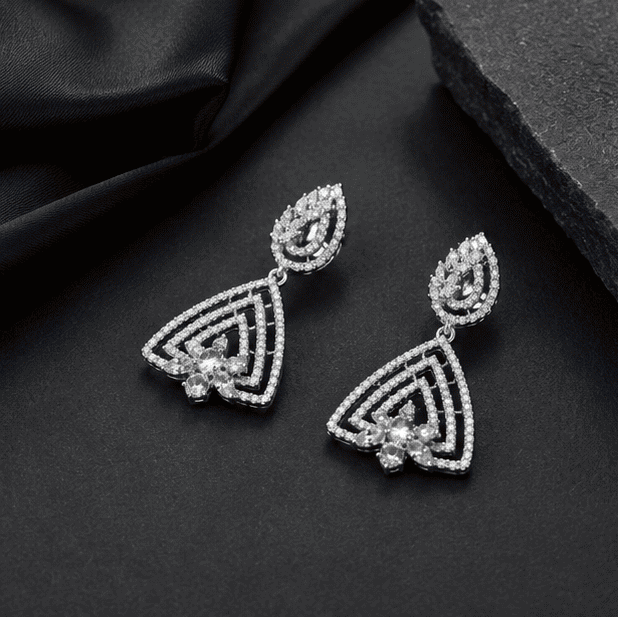 Luxury sterling silver geometric drop earrings featuring brilliant cubic zirconia detailing.