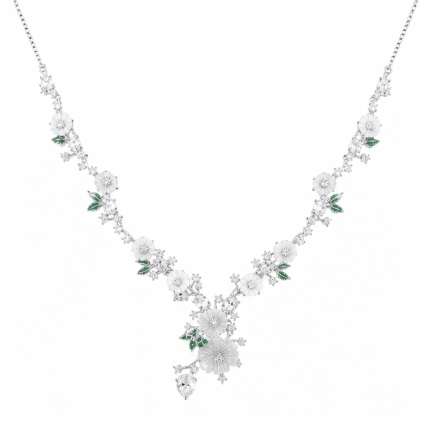 Alt Text:
Front view of a 925 sterling silver floral blossom necklace with white flowers, green enamel leaves, sparkling cubic zirconia, and adjustable slider chain on a white background.