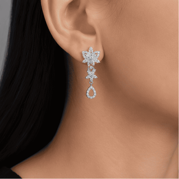 Model wearing elegant 925 sterling silver floral drop earrings