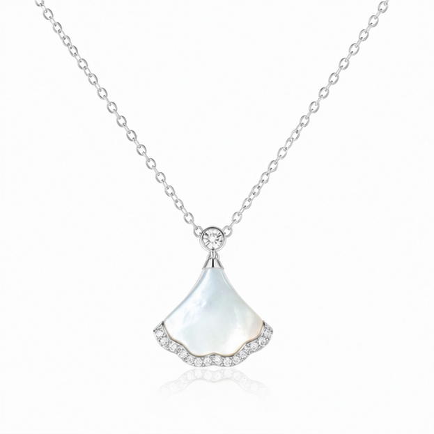 Nacre Tide 925 sterling silver mother of pearl pendant necklace with sparkling zircon detailing on a white background.