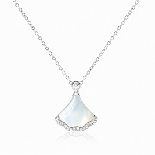 Nacre Tide 925 sterling silver mother of pearl pendant necklace with sparkling zircon detailing on a white background.