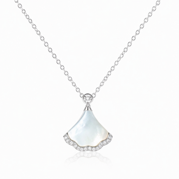 Nacre Tide 925 sterling silver mother of pearl pendant necklace with sparkling zircon detailing on a white background.