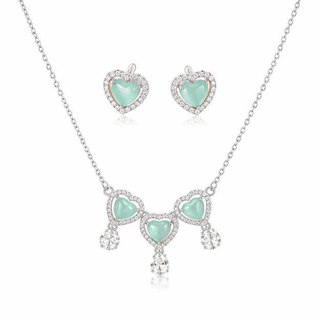 Vrindae Argente Ocea Heart 925 sterling silver necklace set with matching mint green heart earrings on white background.