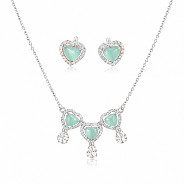 Vrindae Argente Ocea Heart 925 sterling silver necklace set with matching mint green heart earrings on white background.