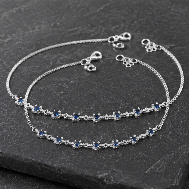 Pair of Celestia Sapphire Starlet Payals in 925 sterling silver displayed together.