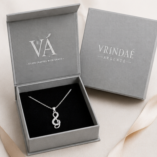 Silver necklace with a unique pendant displayed in various settings.