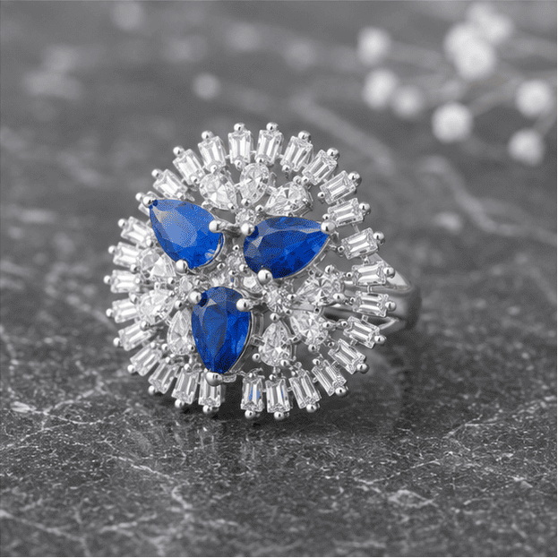 Elegant blue gemstone adjustable silver ring displayed in a modern luxury setting with grey, black, white, and silver tones.