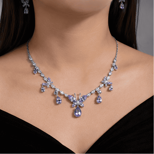 Woman wearing Vrindae Argente 925 sterling silver butterfly necklace set with lavender cubic zirconia crystals and matching earrings.